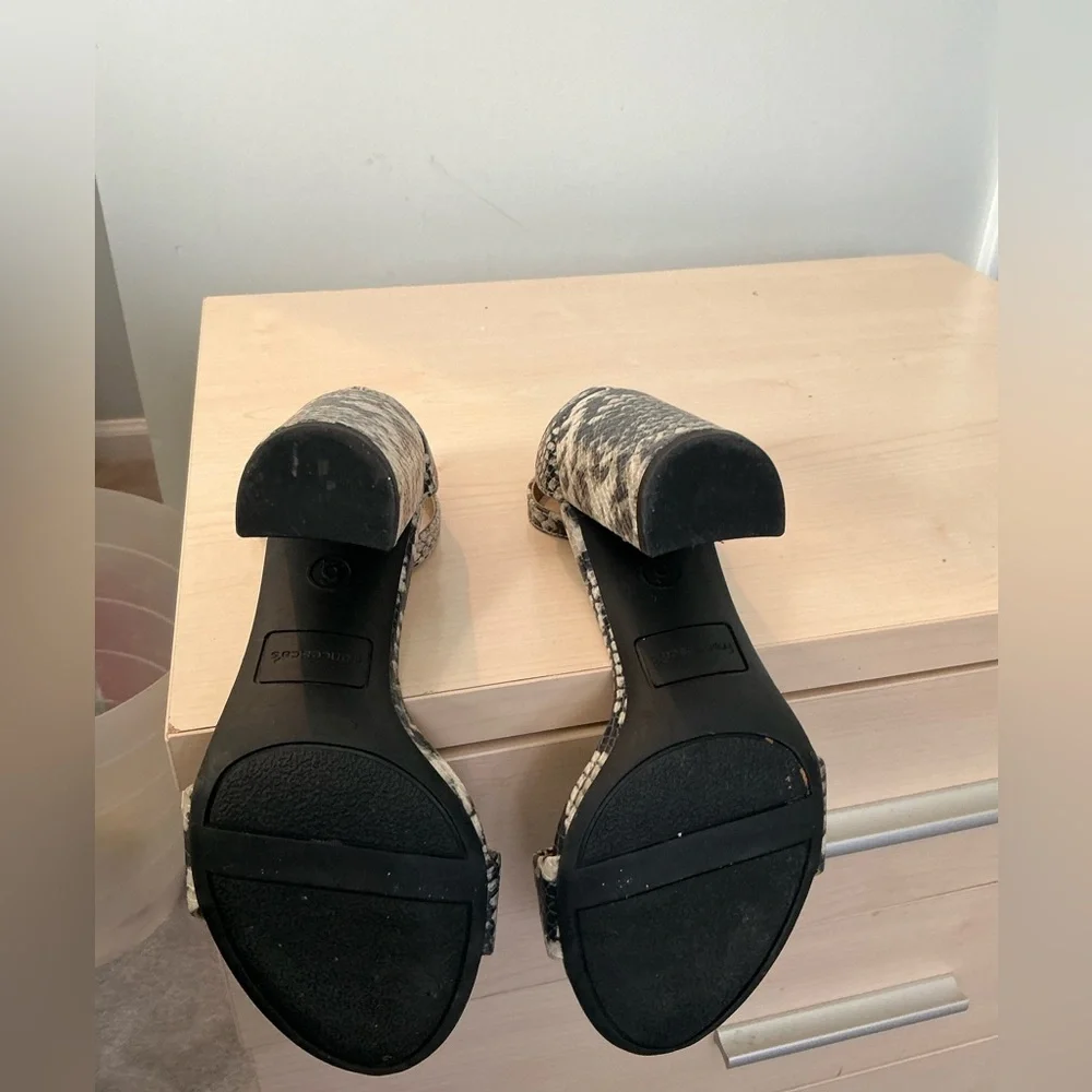 Francesca’s snake print embossed ankle strap heels